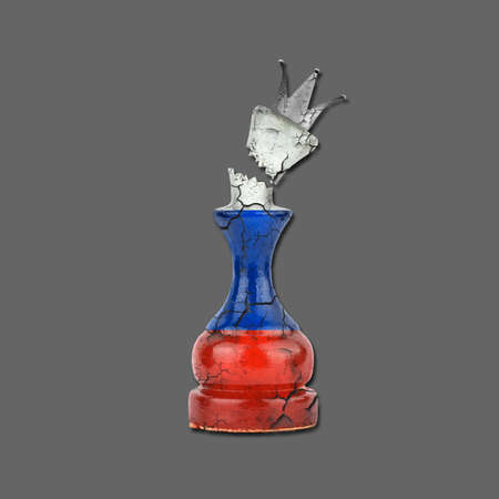 Cracked Chess Queen in the colors of the Russian flag. Isolated on a gray background. Crash of the economy. sanctions. Decline of the economy. blockade. business. politics. Economyの写真素材