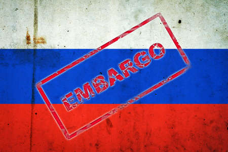 embargo. Red stamp against the background of the flag of Russia. business. politics. Economyの写真素材