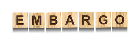 Embargo. Word on wooden blocks. isolated on white background. business. Politics Economyの写真素材