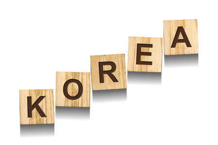 Korea, word on wooden blocks. isolated on a white background. Signs and Symbols.の写真素材