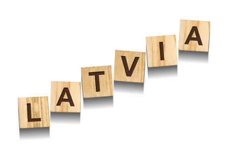 Latvia, word on wooden blocks. isolated on a white background. Signs and Symbols.の写真素材