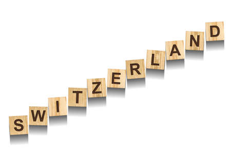 Switzerland, word on wooden blocks. isolated on a white background. Signs and Symbols.の写真素材