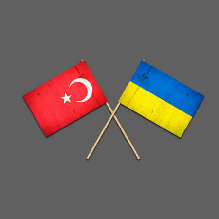 Flags of Turkey and Ukraine, on wooden sticks. Isolated on a gray background. international political relations. commonwealth. support. political economic background.の写真素材