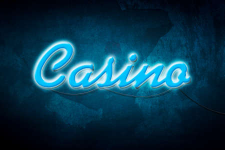 Casino, blue neon inscription on a dark blue background. Poker. Gambling.の写真素材