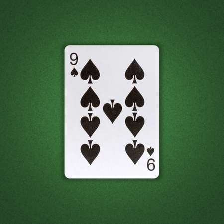 Nine of Spades on a green poker background. Gamble. playing cards. background.の写真素材