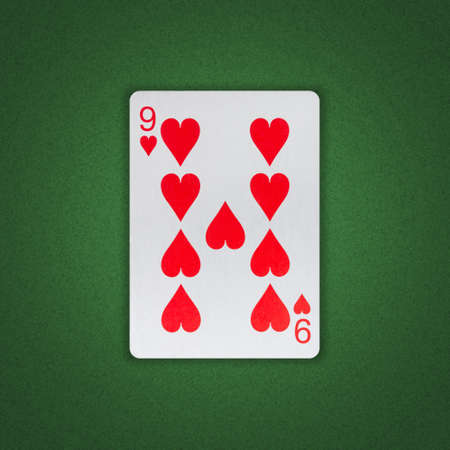 Nine of Hearts on a green poker background. Gamble. playing cards. background.の写真素材