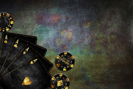 Vintage playing cards and poker chips, on a green grunge background. Four Ace. copyspace. playing cards. Gambling. background.の写真素材