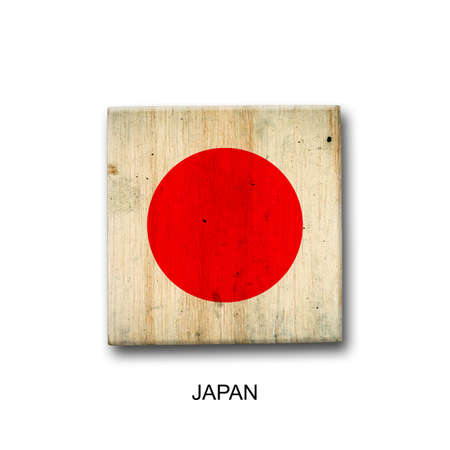 Japan flag on a wooden block. isolated on white background. Signs and symbols. flags.の写真素材