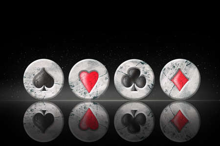 Spades, Herats, Diamonds and Clubs, vintage, grunge, stone poker chips, on a black background. copyspace. Reflection Poker Gambling Backgroundの写真素材
