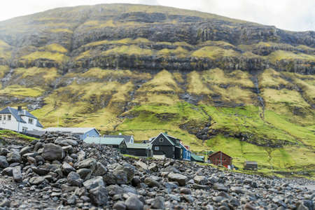 Small village at the foot of the mountain. Tilt-shift effect. Faroe Islands. Denmark. Europe. landscapes. Nature.の写真素材