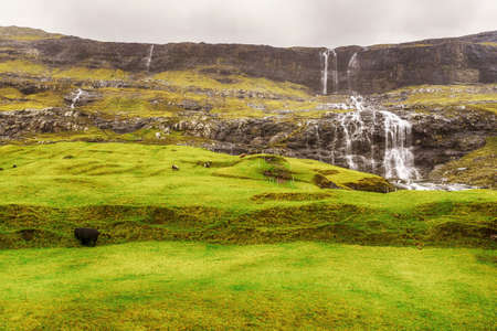 Cascade of waterfalls from beautiful mountains. Faroe Islands. Denmark. Europe. landscapes natureの写真素材