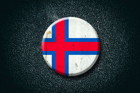 Faroe Islands. Round badge, on a dark background. Signs and Symbols. Flags.3D illustration.の写真素材