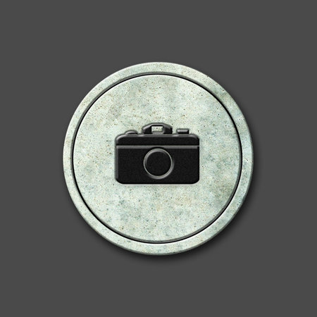 camera. Social icon on a round stone. Isolated on a gray background. social media. design element.の写真素材