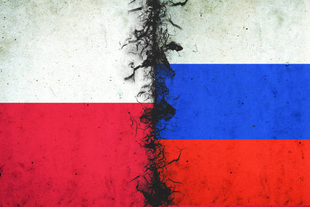 Cracked flags of Russia and Poland. international political relations. conflict. political economic background. politics.の写真素材
