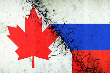 Cracked flags of Russia and Canada. international political relations. conflict. political economic background. politics.の写真素材