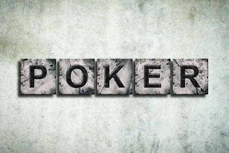 Poker, word on stone blocks, on a gray concrete wall. Poker. Gambling.の写真素材