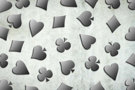 Different card suits, on a grey concrete wall. Gambling concept. 3D illustration.の写真素材