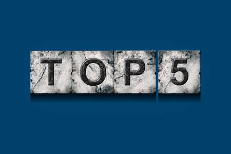 Top 5, words, on a dark blue background. isolated. Alphabet on stone blocks.Rating. rating concept. background.の写真素材