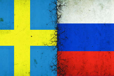 Cracked flags of Russia and Sweden. international political relations. conflict. political economic background. politics.の写真素材