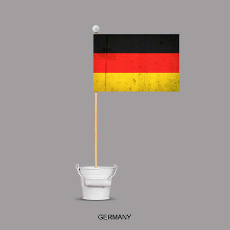 Grunge flag of Germany on a stick, in a small bucket. Isolated on a gray background. Signs and symbols. Flags.Design element.の写真素材