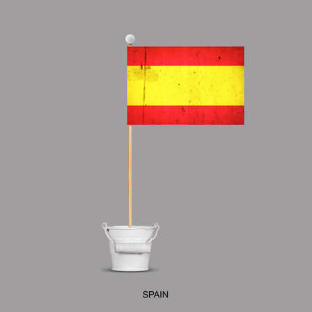 Grunge flag of Spain on a stick, in a small bucket. Isolated on a gray background. Signs and symbols. Flags.Design element.の写真素材