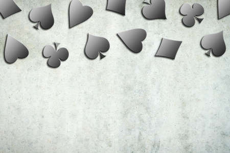 Different card suits, on a gray concrete wall. copyspace. Gambling concept. 3D illustration. backgroundの写真素材