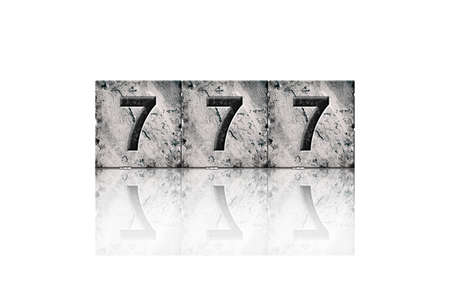 777. Three sevens, digits on stone blocks. Reflection. Isolated on white background. Design element.の写真素材