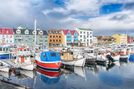 Faroe islands. Denmark. 11 May. 2022. Boats parked in the bay, among the beautiful small, colorful houses. Europe.Transport. Water transport Landscapes Natureの写真素材