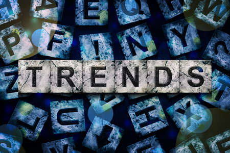 Trends, word on an alphabet on stone blocks, on dark blue background.Business. Background.の写真素材