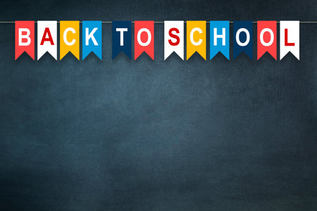 Back to school, words written on multi-colored, paper flags, on the background of the school board. The concept of the new school year. copy space. Education. Background.の写真素材