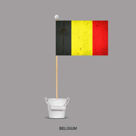 Grunge flag of Belgium on a stick, in a small bucket. Isolated on a gray background. Signs and symbols. Flags.Designの写真素材