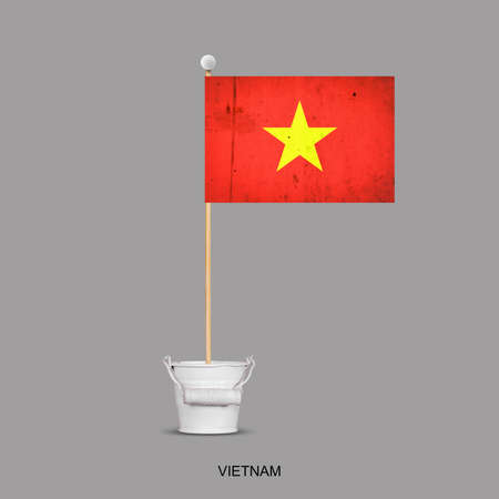 Grunge flag of Vietnam on a stick, in a small bucket. Isolated on a gray background. Signs and symbols. Flags.Designの写真素材