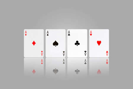 Four Ace. Playing cards on a gray background. Reflection. Gambling.の写真素材
