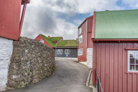 Beautiful wooden, red, small houses in narrow streets. Faroe islands. Denmark Architectureの写真素材