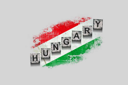 Hungary, words on stone blocks, on grunge background of Hungary flag. Isolated on white background. Design element. Signs and symbols.Countries.の写真素材