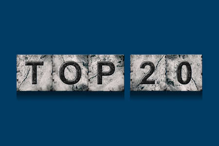 Top 20, words, isolated on a dark blue background. Alphabet on stone blocks.Rating. Rating concept. Background.の写真素材