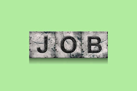 Job. Word on stone blocks. Isolated on a green background. Design element.Lifestyle. Business.の写真素材