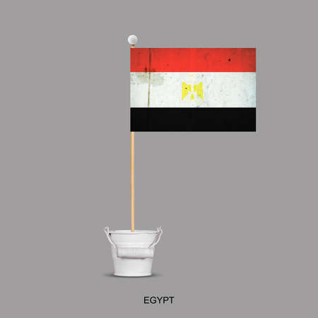Grunge Flag of Egypt on a stick, in a small bucket. Isolated on a gray background. Signs and symbols. Flags.Design element.の写真素材