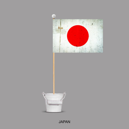 Grunge Flag of Japan on a stick, in a small bucket. Isolated on a gray background. Signs and symbols. Flags.Design element.の写真素材