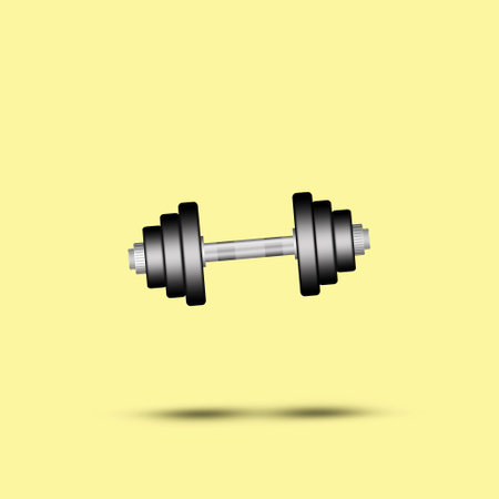 Dumbbell on a yellow background. Shadow. Isolated. Sports equipment, gym, fitness Sports backgroundの写真素材