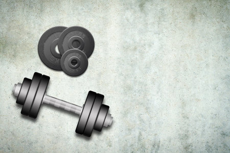 Dumbbells with discs of different weights, on a concrete background. Copy space. Place for text. Sports equipment, gym, fitness. Sports background.の写真素材