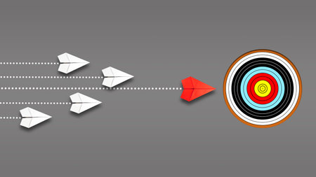 Group of paper planes is flying toward the target, led by a red plane on a gray background. The concept of leadership, achieving the goal. Success. Business. Lifestyle. Background.の写真素材