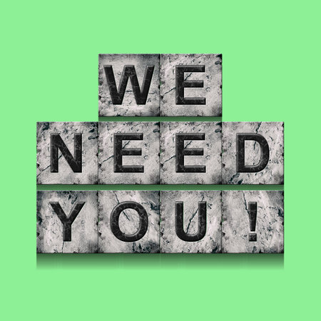 We Need You. Word on stone blocks. Isolated on a green background. Design element.Lifestyle. Business.の写真素材