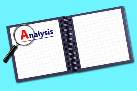 Concept of Analysis. Notepad and magnifying glass. Isolated on a blue background. Copy space. Place for text. Business. Background.の写真素材
