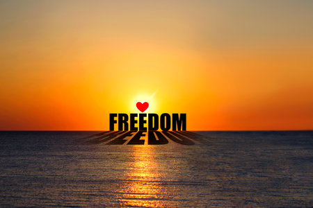 Freedom. Word on the background of the sunset over the ocean. Concept of freedom. Lifestyle. Backgroundの写真素材