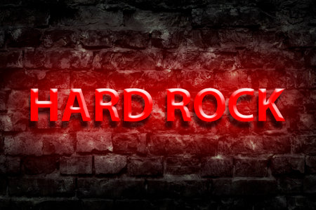 Hard Rock. Neon sign. On old vintage bricks wall. Direction in music. Musical style. Design element.の写真素材