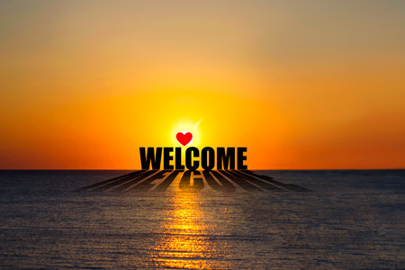 Welcome. Word on the background of the sunset over the ocean. Lifestyle. Backgroundの写真素材