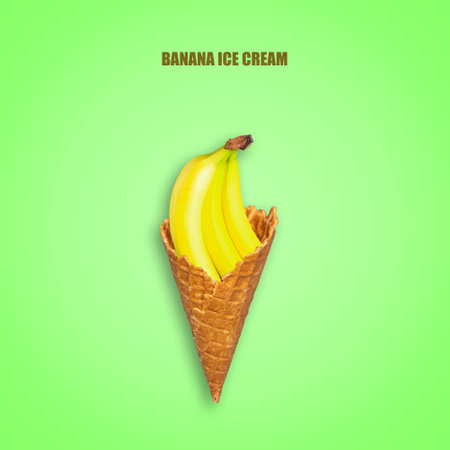 Bananas in an ice cream cone, on a bright green background. Concept of natural banana ice cream. Food. Dessert.の写真素材