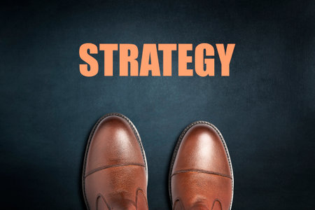 Strategy concept. Men's boots on a dark background. Top view. Business. Background.の写真素材