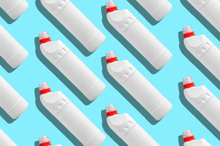 Lot of plastic white bottles for cleaning products and household chemicals on a blue background. Copy space. House cleaning. Background.の写真素材
